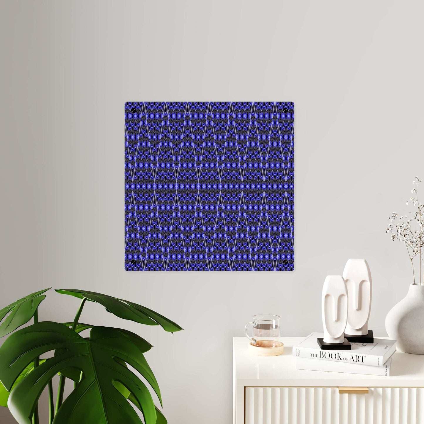 Blue geometric acrylic wall art panel with modern abstract pattern and vibrant blue and black colors on clear glossy surface.